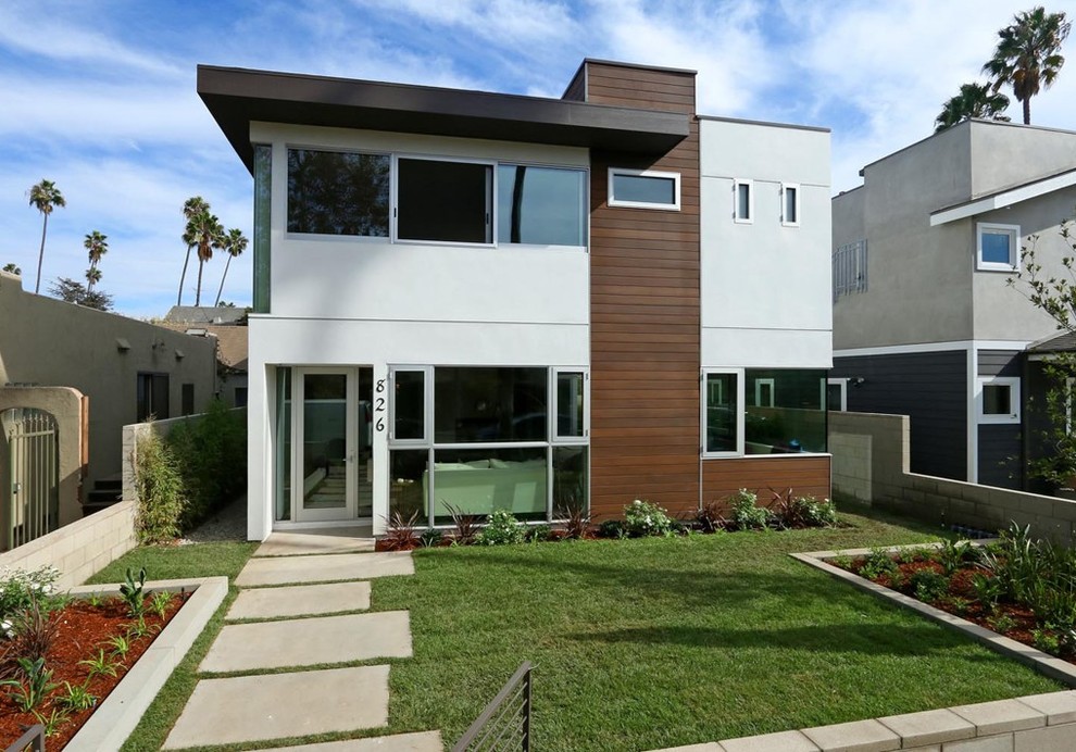 Inspiration for a medium sized and white contemporary two floor render house exterior in Los Angeles.