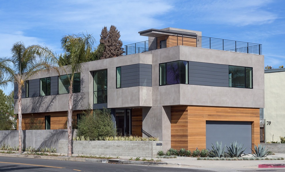 Diseño de fachada de casa multicolor actual de dos plantas con revestimientos combinados y tejado plano