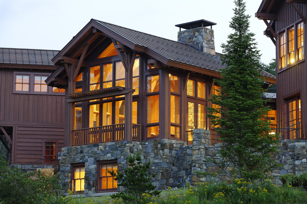 Huge mountain style three-story mixed siding exterior home photo in Boston with a metal roof