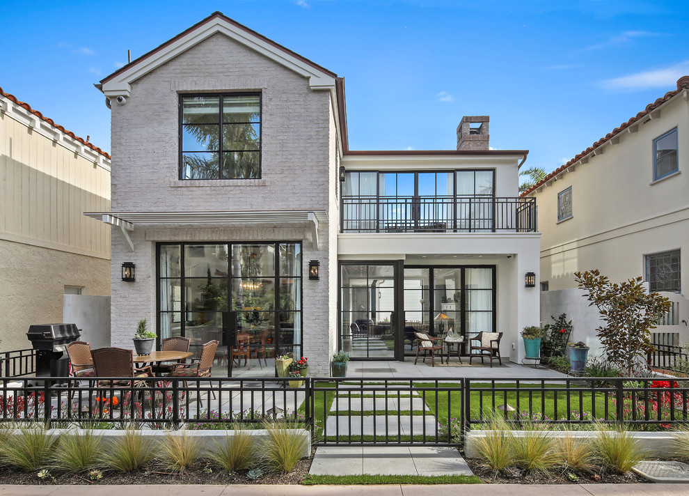 Transitional gray two-story mixed siding gable roof idea in Orange County