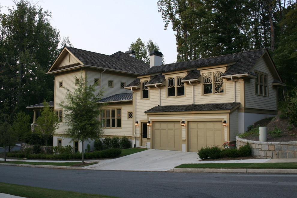 Inspiration for a traditional house exterior in Atlanta with wood cladding.