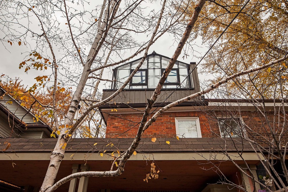 Contemporary brick exterior home idea in Toronto