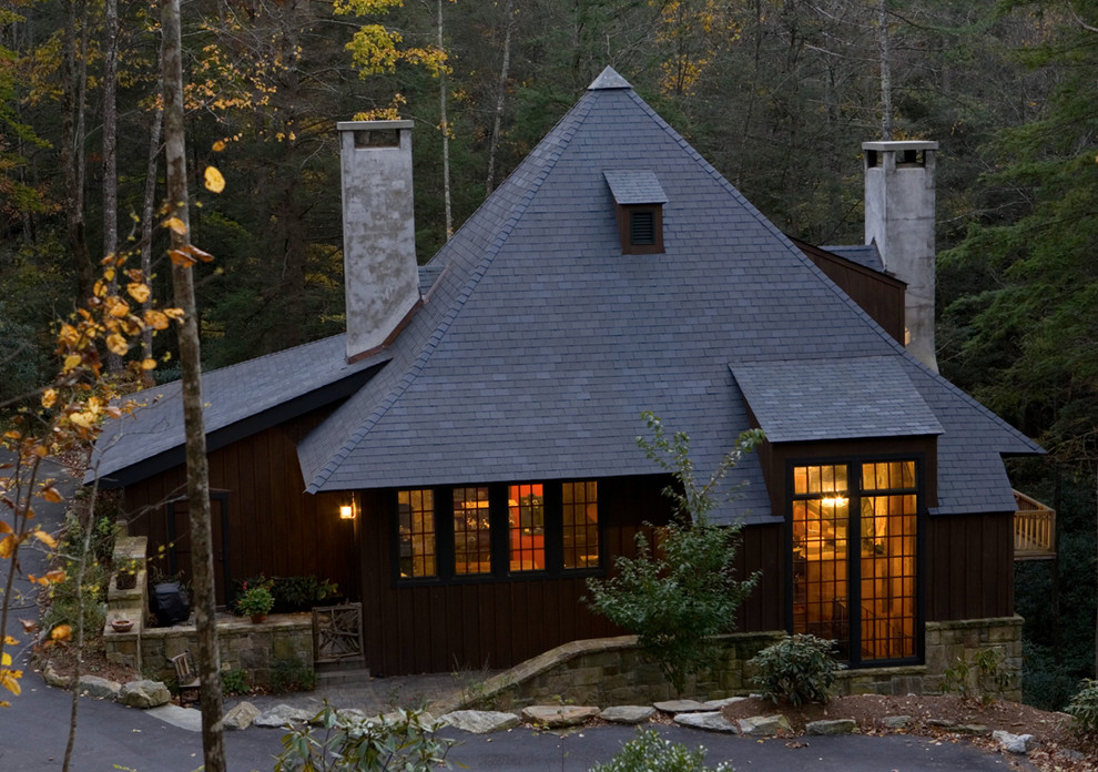 Example of an ornate one-story exterior home design in Birmingham with a hip roof and a shingle roof