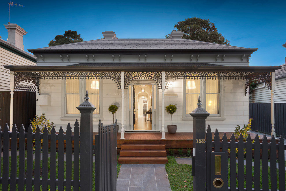 Design ideas for a white victorian bungalow detached house in Melbourne with a hip roof and a shingle roof.