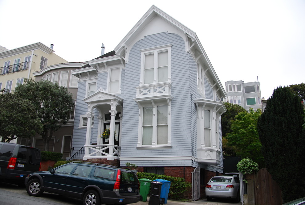 This is an example of a blue victorian two floor house exterior in San Francisco.