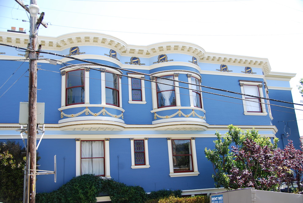 This is an example of a blue victorian two floor house exterior in San Francisco.