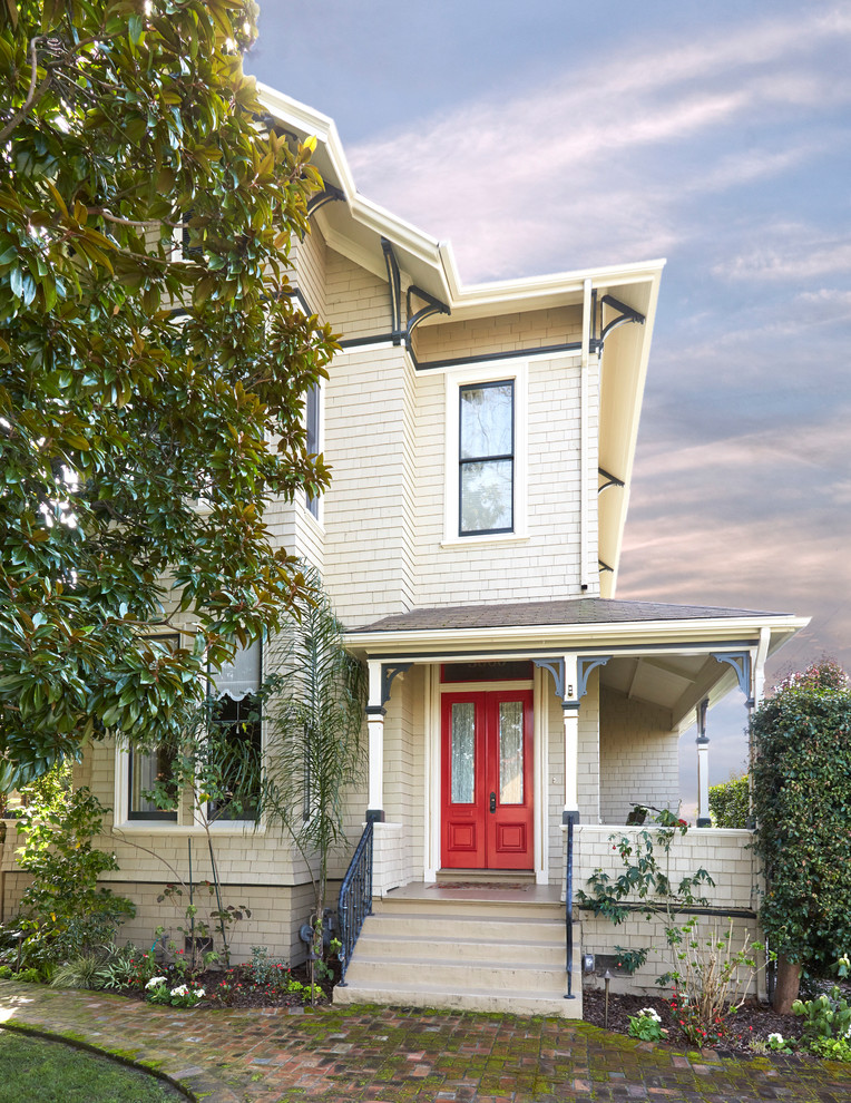 Photo of a large and beige victorian two floor detached house in San Francisco.