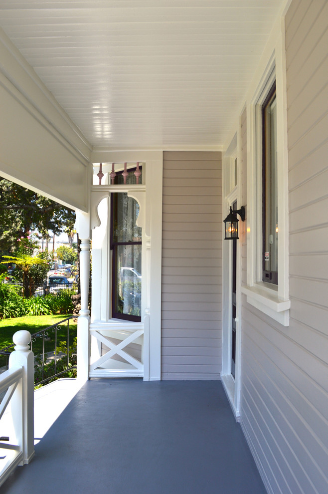 Photo of a victorian two floor house exterior in Los Angeles with wood cladding.