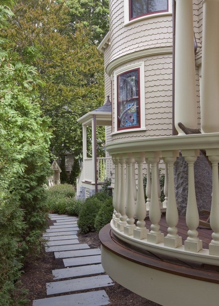 Design ideas for a victorian house exterior in Boston with wood cladding.