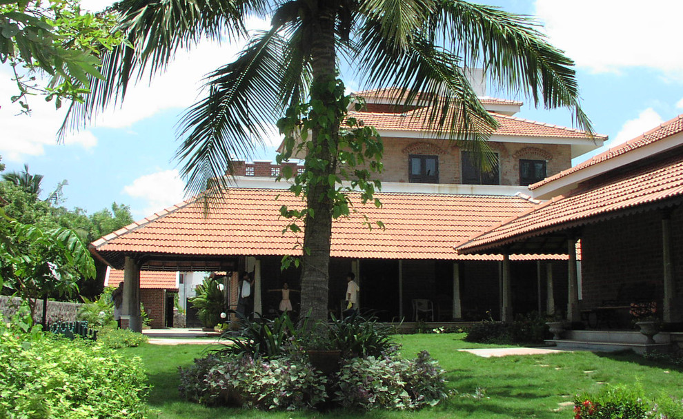 Example of an asian exterior home design in Chennai