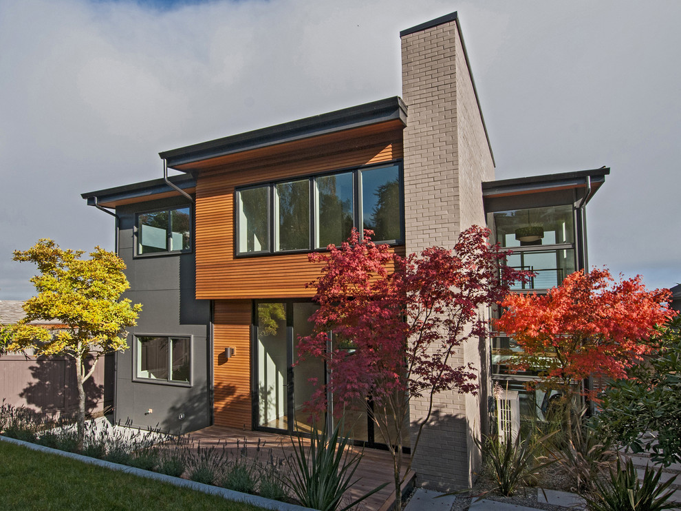 Photo of a contemporary two floor house exterior in Seattle with mixed cladding.