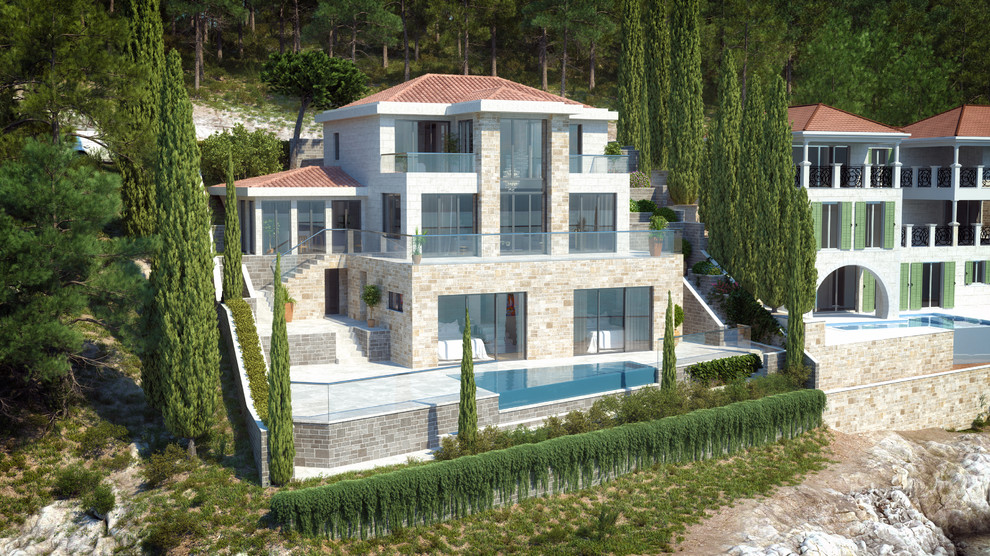 他の地域にある地中海スタイルのおしゃれな三階建ての家 (石材サイディング) の写真