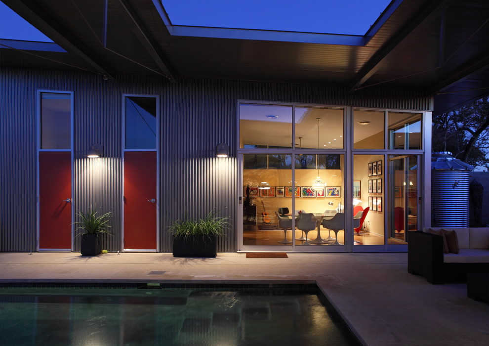 Example of a trendy metal exterior home design in Austin