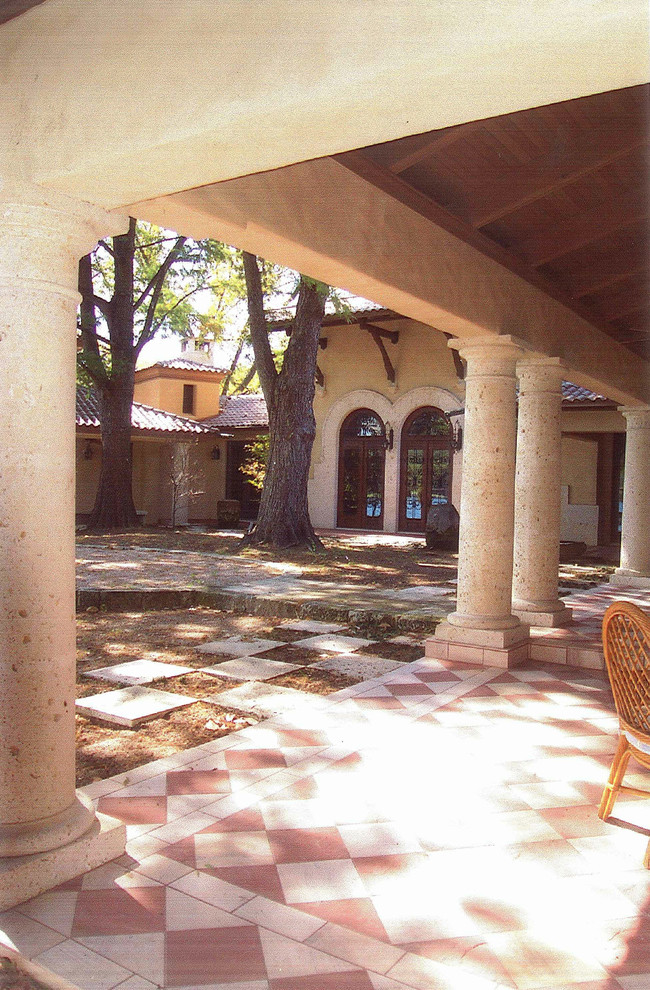 Photo of a large mediterranean two floor render house exterior in Austin.