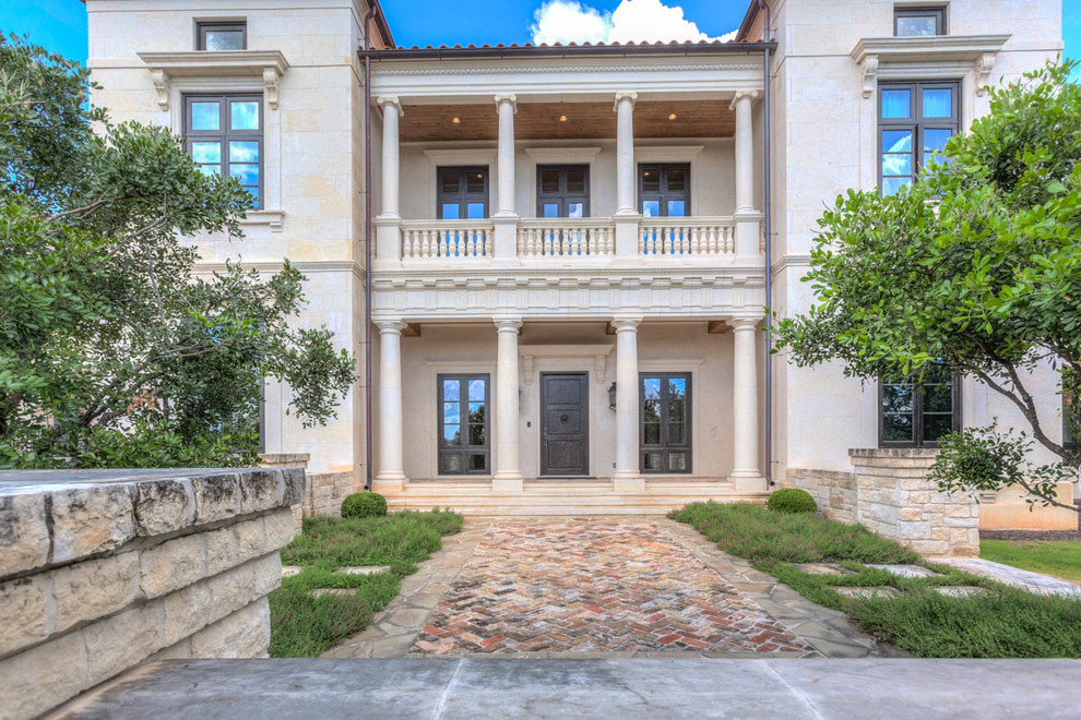 Example of a huge white two-story exterior home design in Austin
