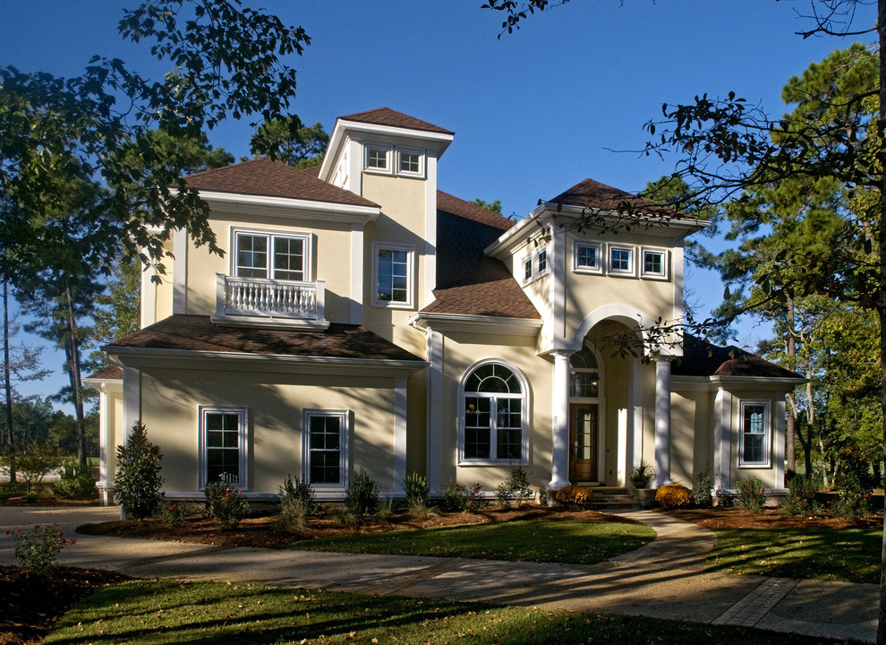 Tuscan three-story exterior home photo in Raleigh