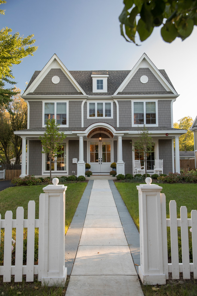 Inspiration for a mid-sized timeless gray two-story concrete fiberboard exterior home remodel in Chicago with a shingle roof