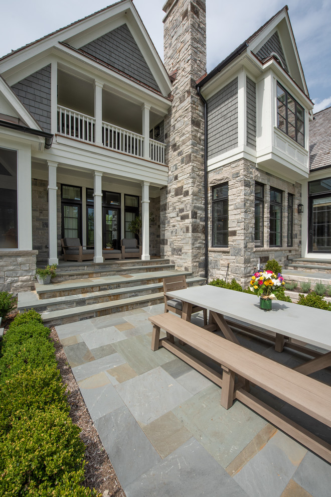 Large elegant gray two-story mixed siding exterior home photo in Chicago with a shingle roof