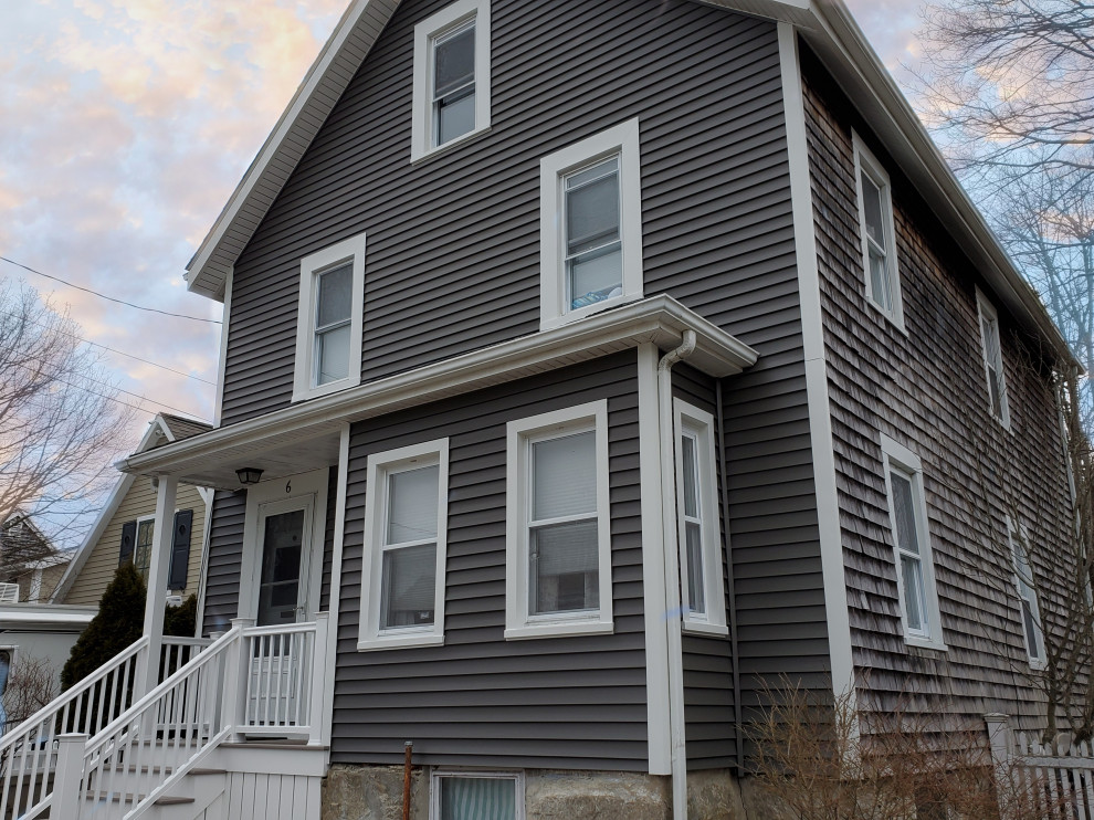 Photo of a gey classic detached house in Providence with a pitched roof and a shingle roof.