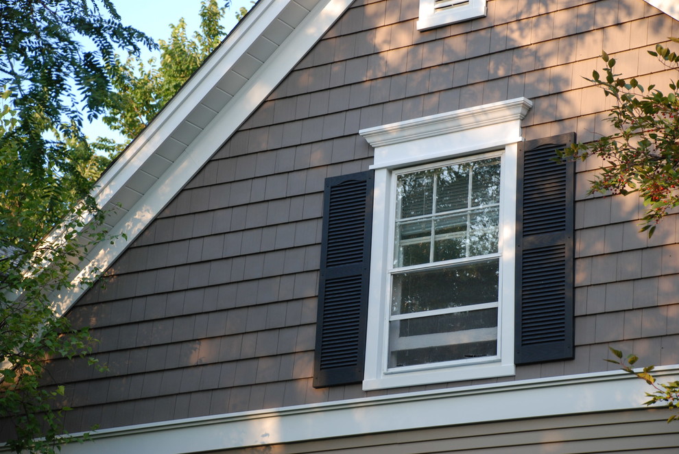 Mid-sized arts and crafts brown two-story vinyl house exterior photo in Chicago with a shingle roof