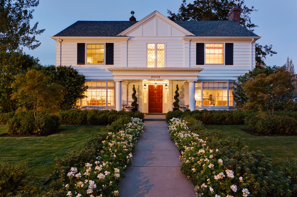 Mid-sized elegant white two-story gable roof photo in Portland