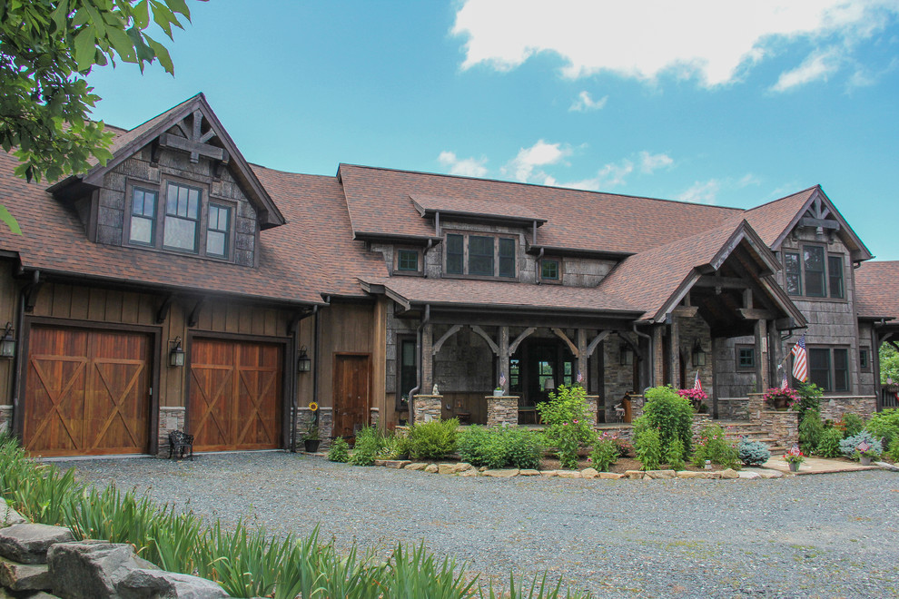 Inspiration for a large rustic brown two-story mixed siding gable roof remodel in Charlotte
