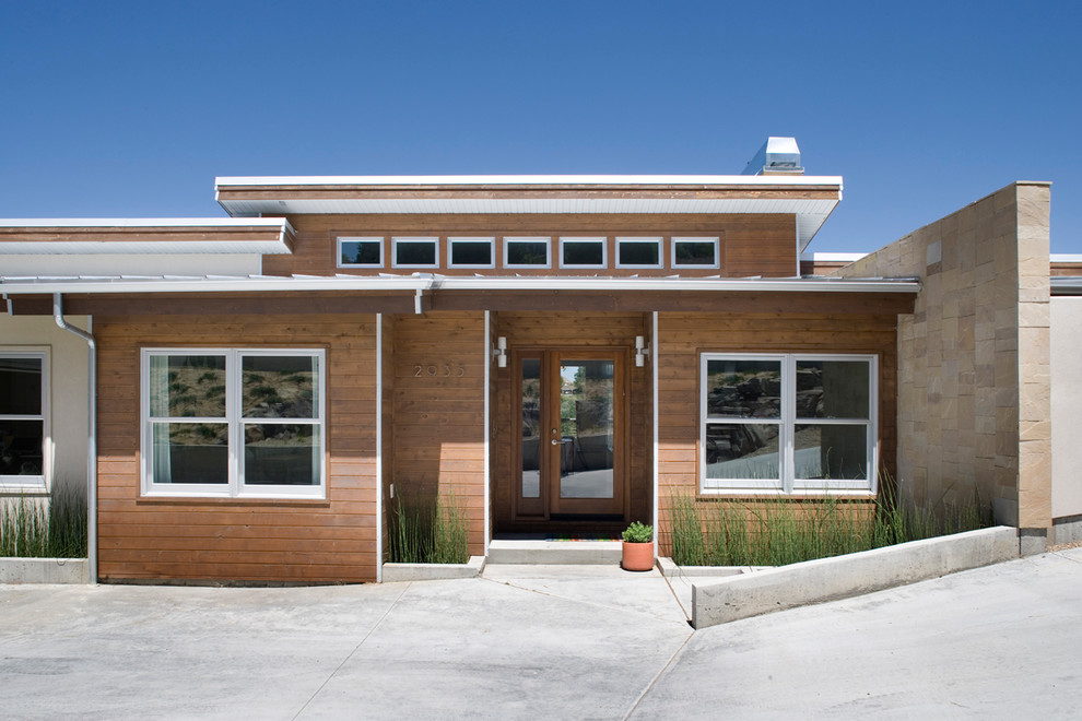 Trendy wood exterior home photo in Boise