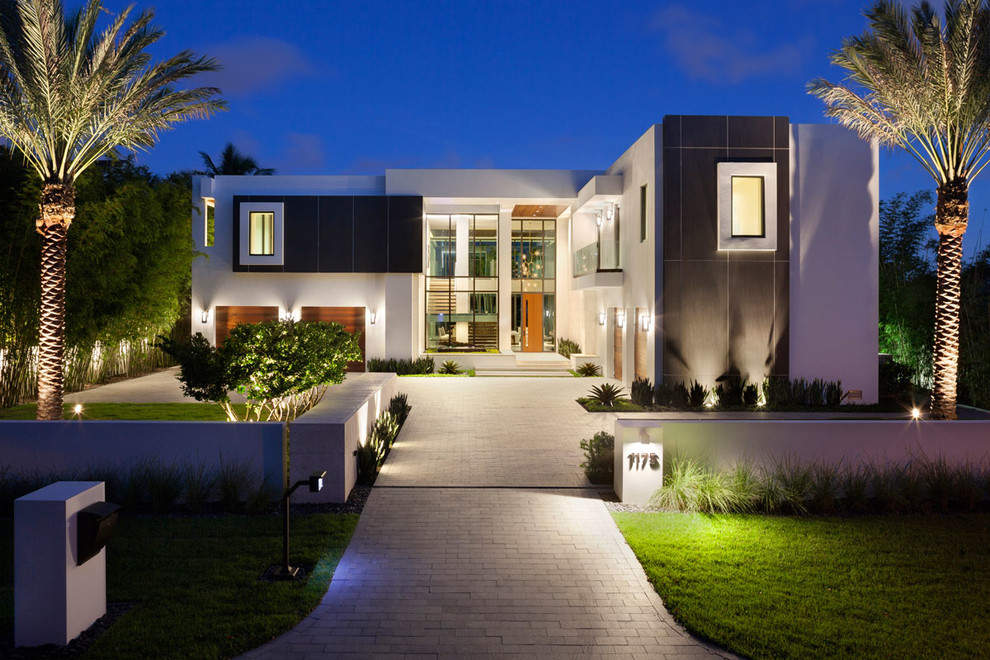 Large and white modern two floor house exterior in Miami with a flat roof.