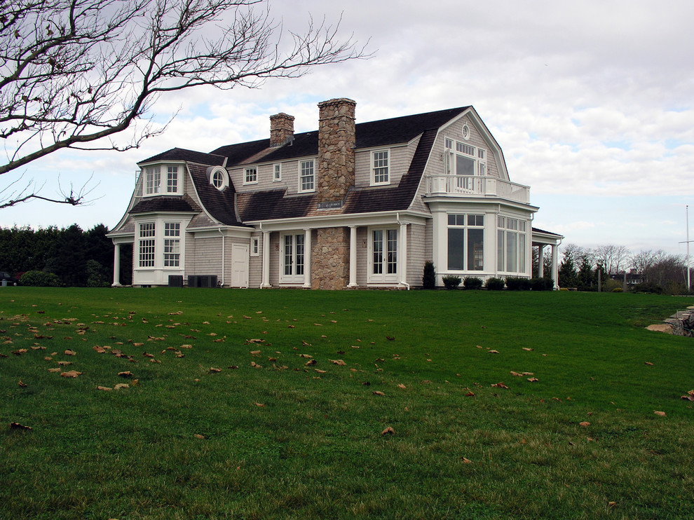 Inspiration for a victorian house exterior in Providence with stone cladding.
