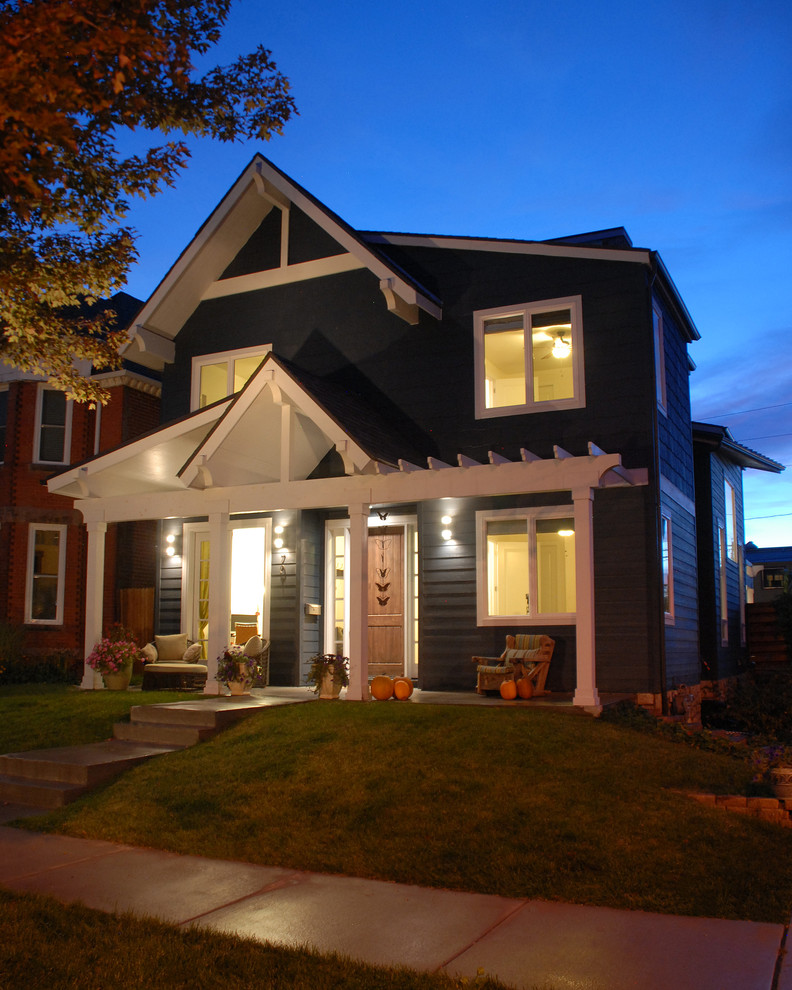 Example of a mid-sized eclectic gray two-story concrete fiberboard gable roof design in Denver