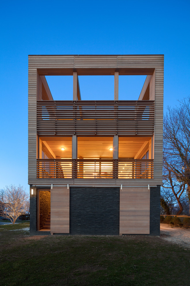 Inspiration for a brown contemporary house exterior in Providence with three floors and wood cladding.