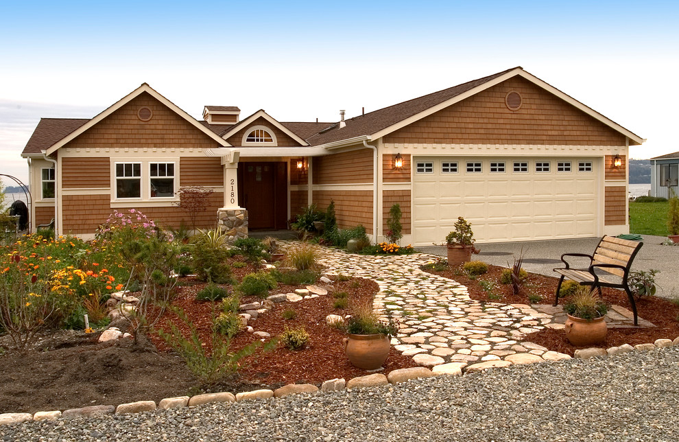 Example of a mid-sized beach style brown one-story wood exterior home design in Seattle