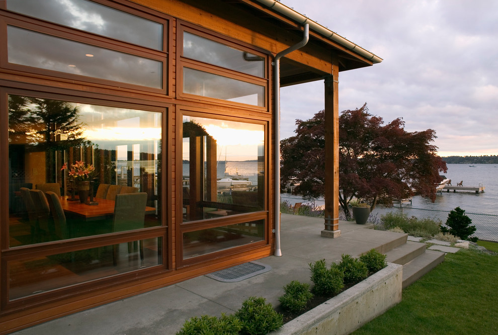 Inspiration for a contemporary two-story wood gable roof remodel in Seattle