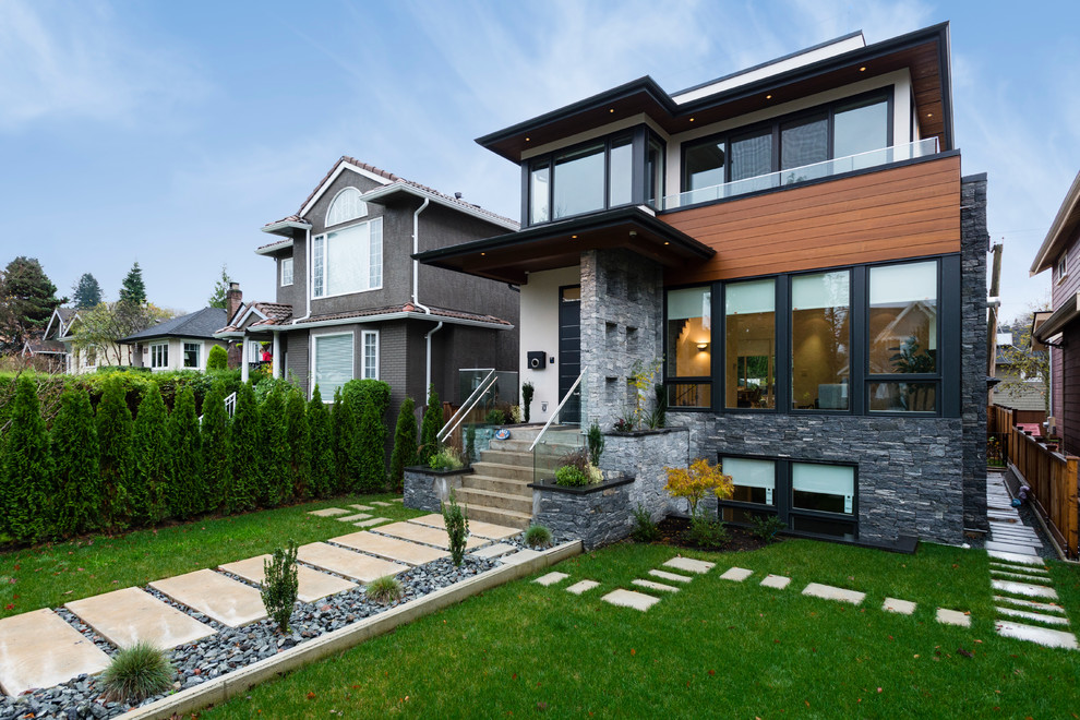 Large and white contemporary two floor render house exterior in Vancouver.