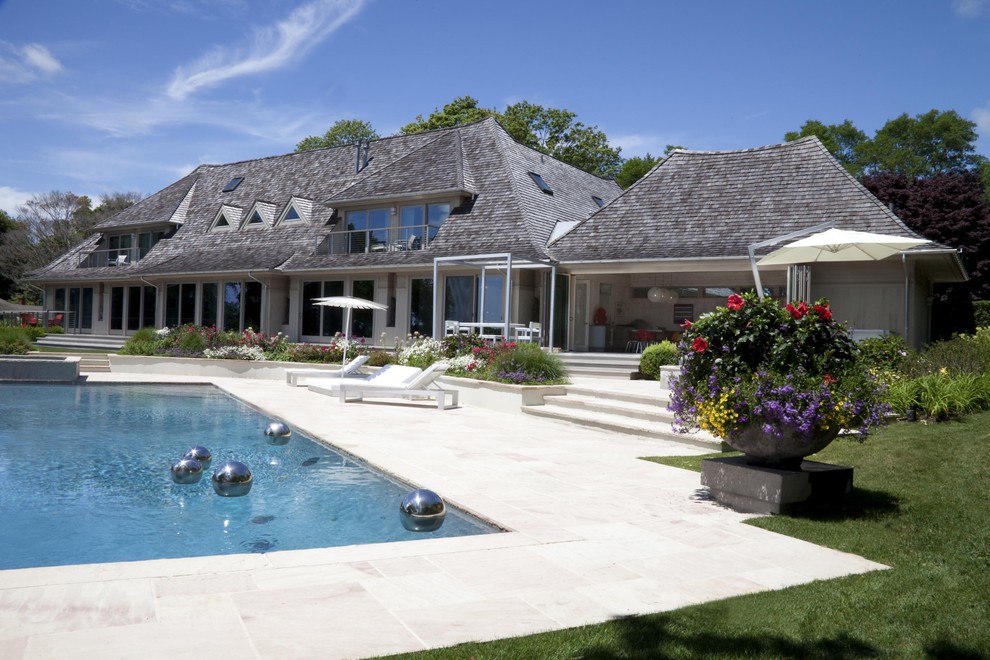 Example of a large beach style exterior home design in New York