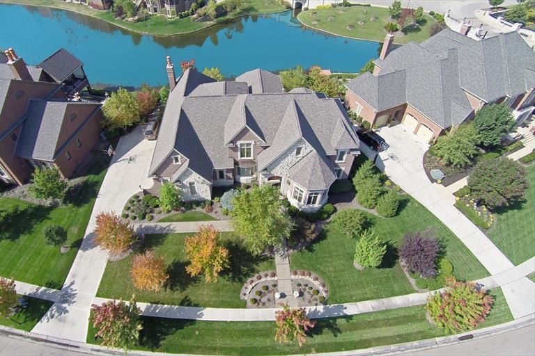 Example of a large transitional beige two-story stone exterior home design in Cincinnati