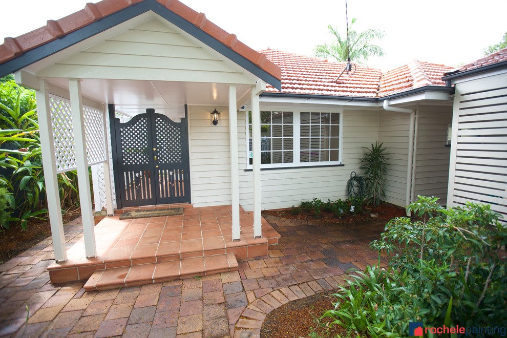White traditional house exterior in Brisbane with wood cladding.