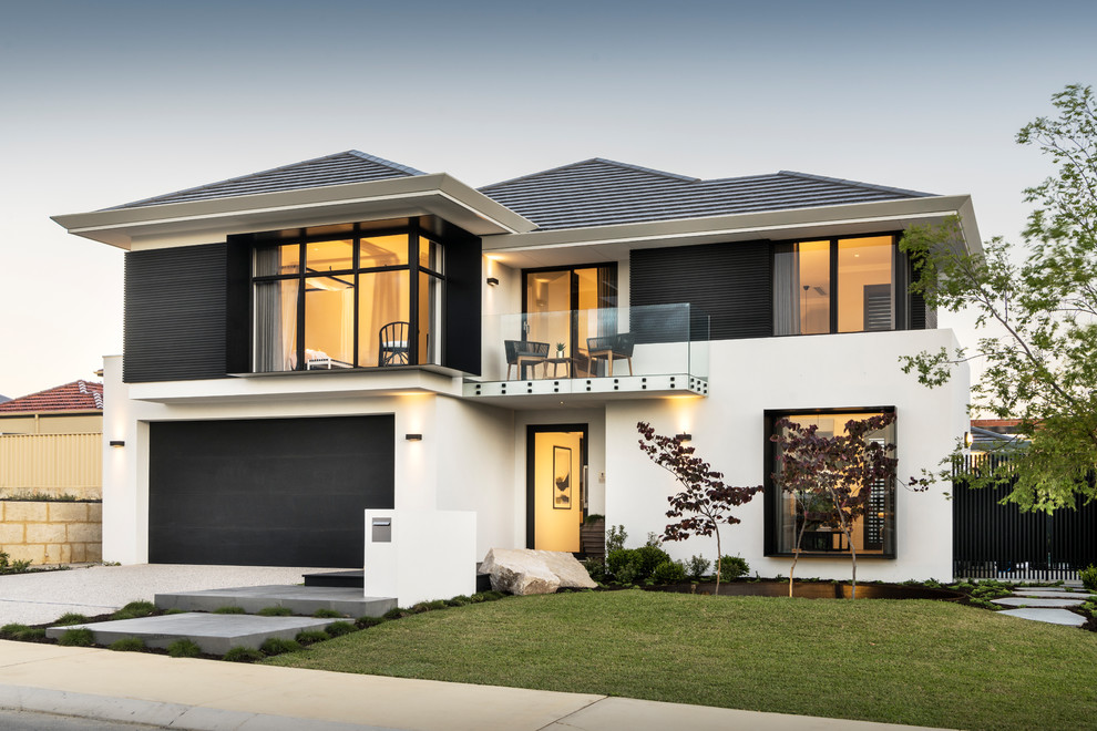 Inspiration for a contemporary white two-story mixed siding house exterior remodel in Perth with a hip roof and a shingle roof