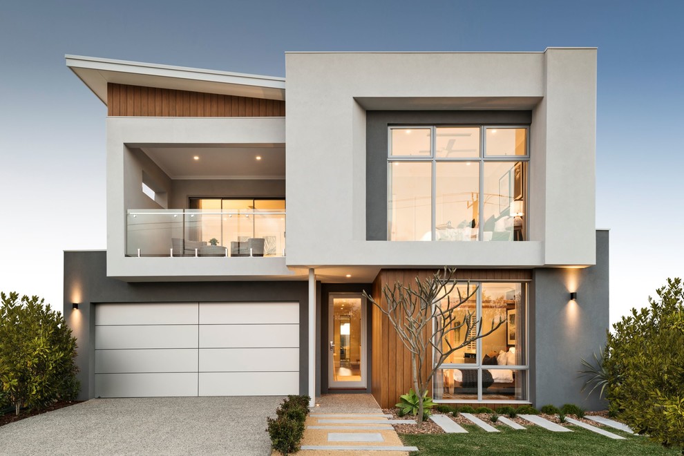 Idées déco pour une façade de maison multicolore contemporaine à un étage avec un revêtement mixte et un toit en appentis.