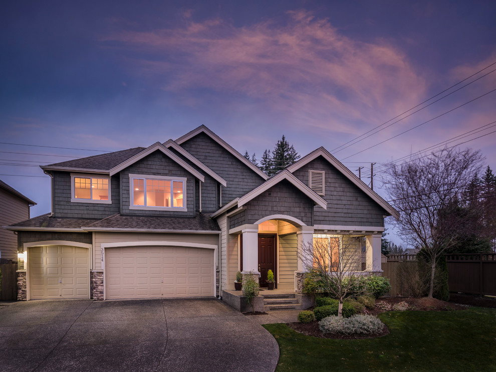 Inspiration for a timeless gray two-story mixed siding house exterior remodel in Seattle with a shingle roof