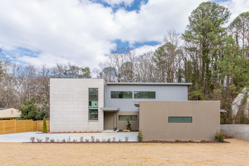 Idee per la facciata di una casa grande contemporanea a due piani con rivestimento in pietra