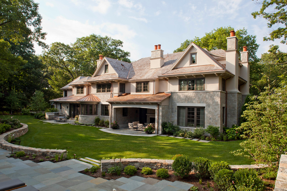 Inspiration for a huge craftsman beige three-story mixed siding exterior home remodel in Boston
