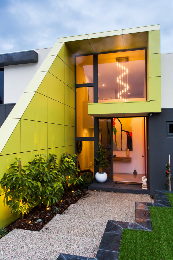 This is an example of a medium sized and green contemporary two floor house exterior in Geelong.
