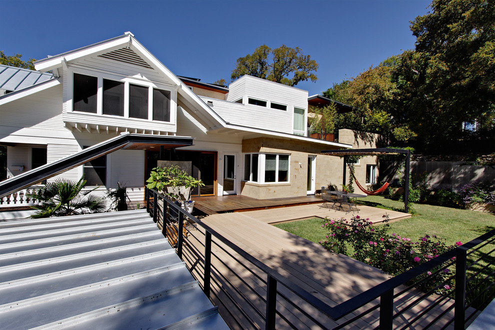 Design ideas for a traditional two floor house exterior in Austin.