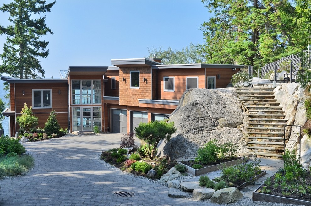 Photo of a brown contemporary house exterior in Vancouver.