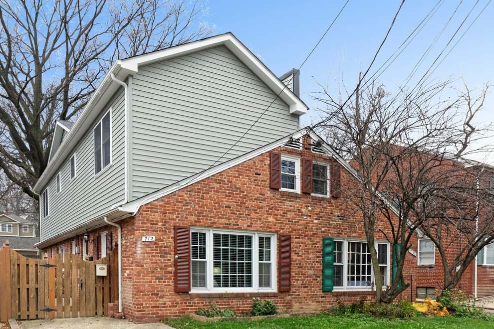 Example of a mid-sized arts and crafts gray two-story vinyl exterior home design in DC Metro