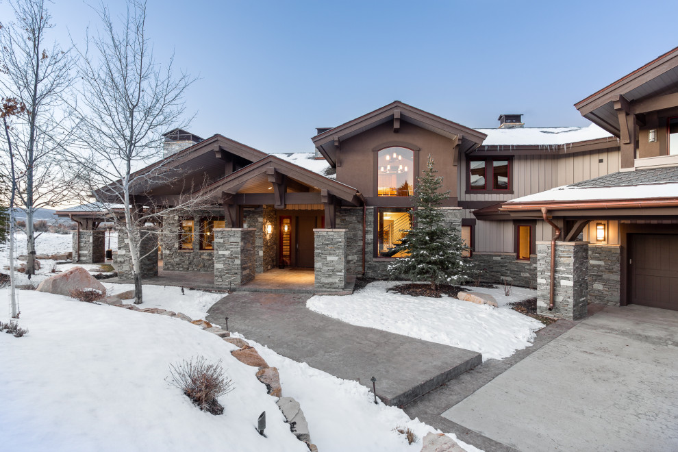 Example of a huge classic three-story exterior home design in Salt Lake City