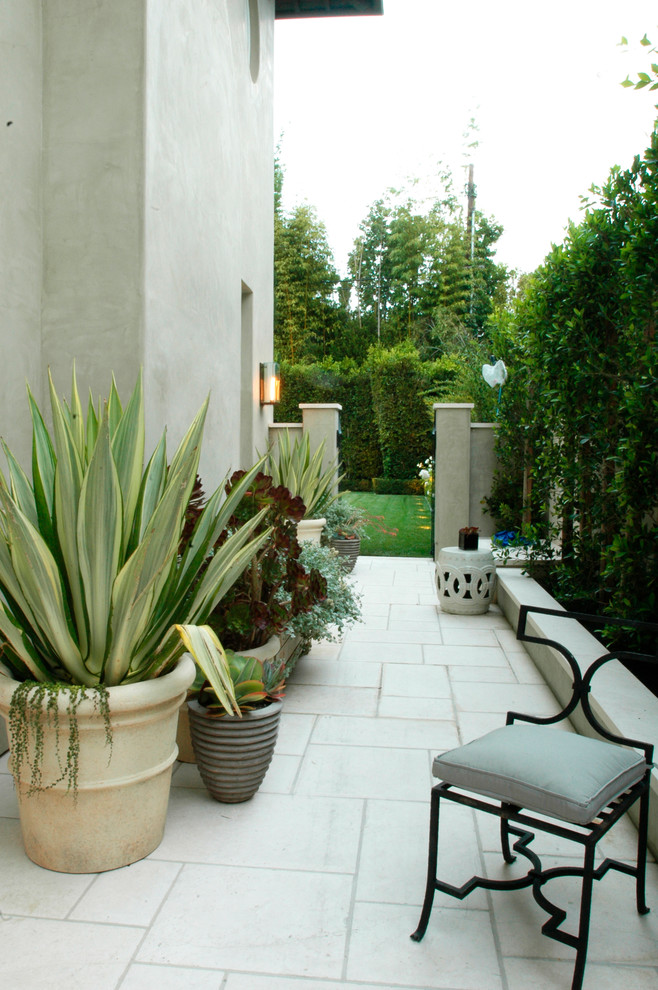 Inspiration for a large and beige mediterranean two floor render house exterior in Los Angeles.