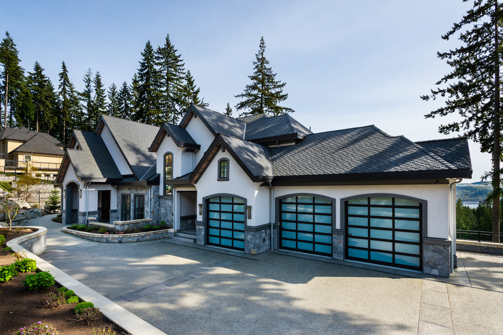 Expansive and multi-coloured traditional detached house in Vancouver with three floors, mixed cladding, a pitched roof and a shingle roof.