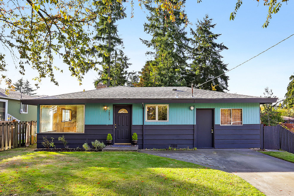 Small 1950s blue one-story wood house exterior photo in Seattle with a shingle roof